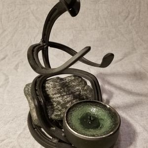 Horseshoe art cowboy by fire